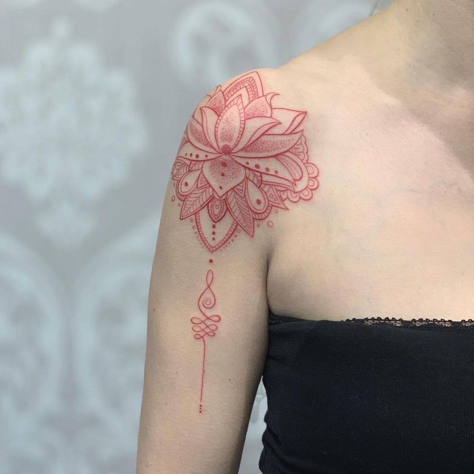 Shoulder blade tattoo of a lotus flower by tattoo