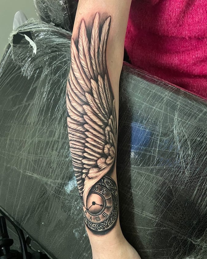 angel wing tattoo arm